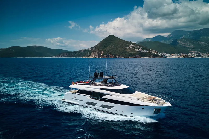  Yacht Photos Pics Luxurious 2023 Ferretti Yachts 920 cruising in scenic coastal waters.