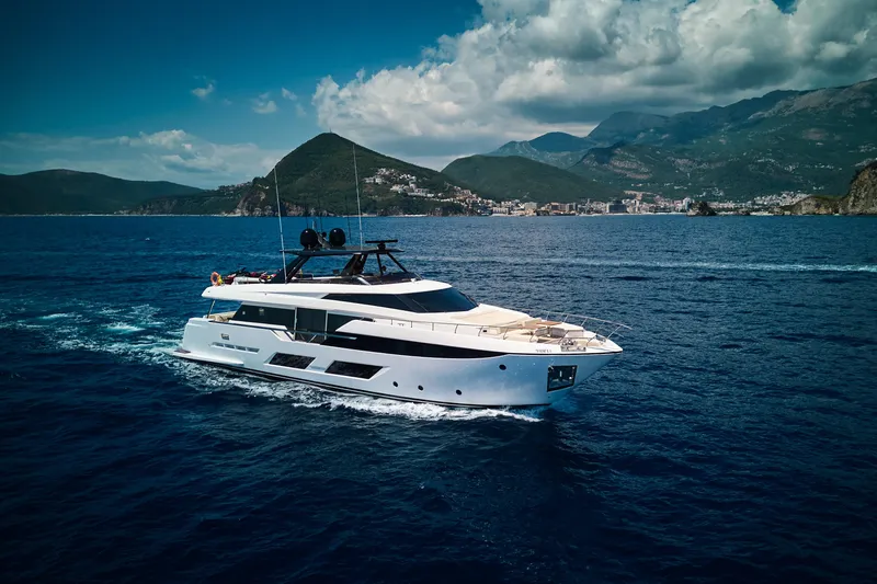  Yacht Photos Pics Luxurious 2023 Ferretti Yachts 920 cruising in scenic coastal waters.