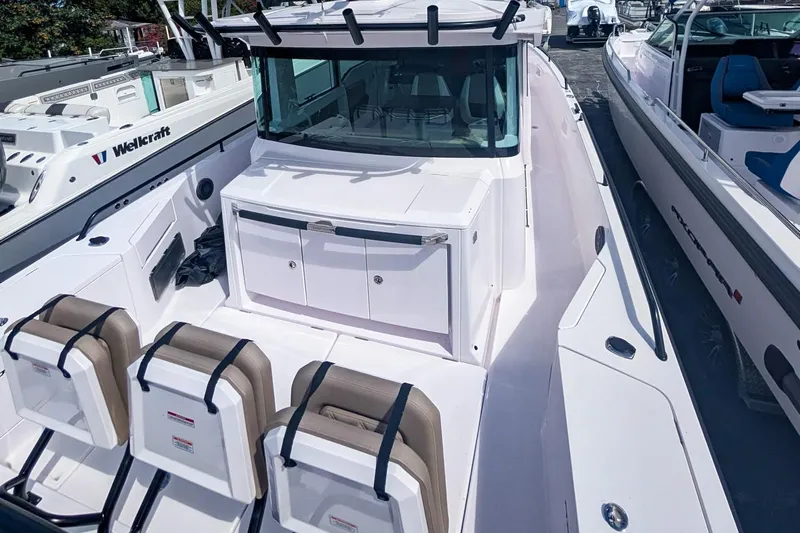  Yacht Photos Pics 2024 Axopar 37XC CROSS CABIN BRABUS Trim boat with sleek design and comfortable seating.