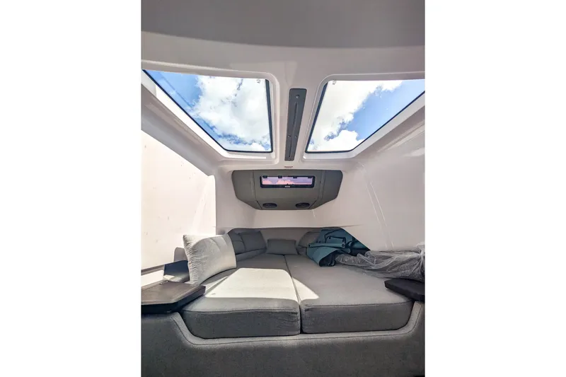  Yacht Photos Pics 2024 Axopar 37XC CROSS CABIN BRABUS interior with skylights and comfortable seating.