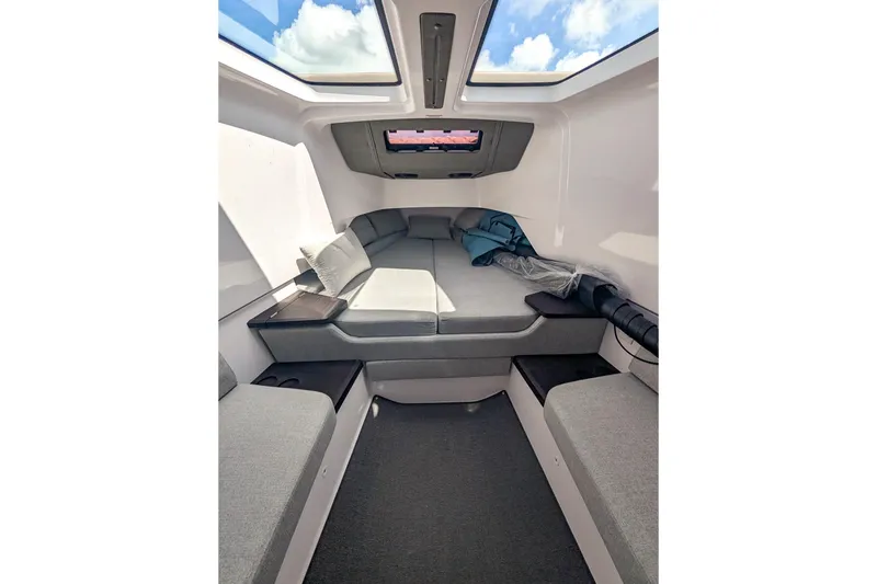  Yacht Photos Pics 2024 Axopar 37XC CROSS CABIN BRABUS interior with skylight and comfortable seating.