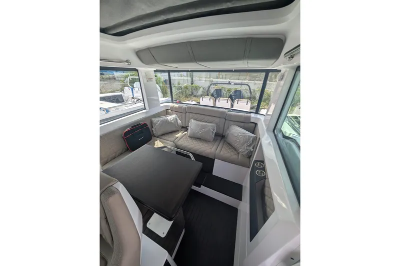  Yacht Photos Pics Luxurious interior of 2024 Axopar 37XC CROSS CABIN BRABUS Trim with plush seating.