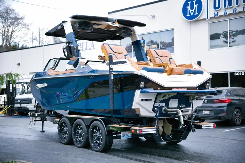 Yacht Photos Pics 2024 Nautique Super Air Nautique G23 Paragon boat on trailer outside dealership.