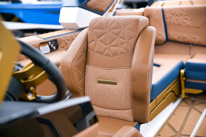  Yacht Photos Pics 2024 Nautique Super Air Nautique G23 Paragon interior with luxurious tan leather seating.
