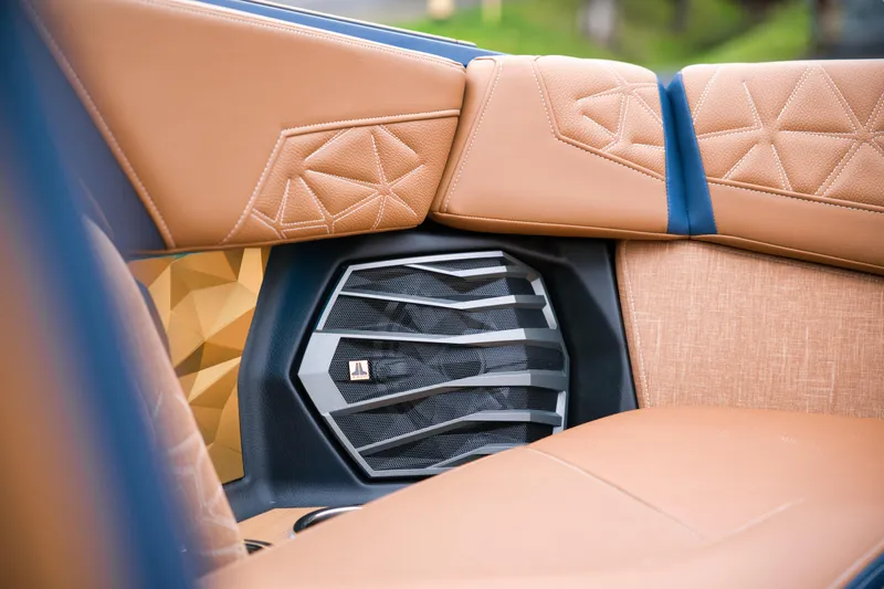  Yacht Photos Pics 2024 Nautique Super Air Nautique G23 Paragon interior with premium leather seating and speaker detail.