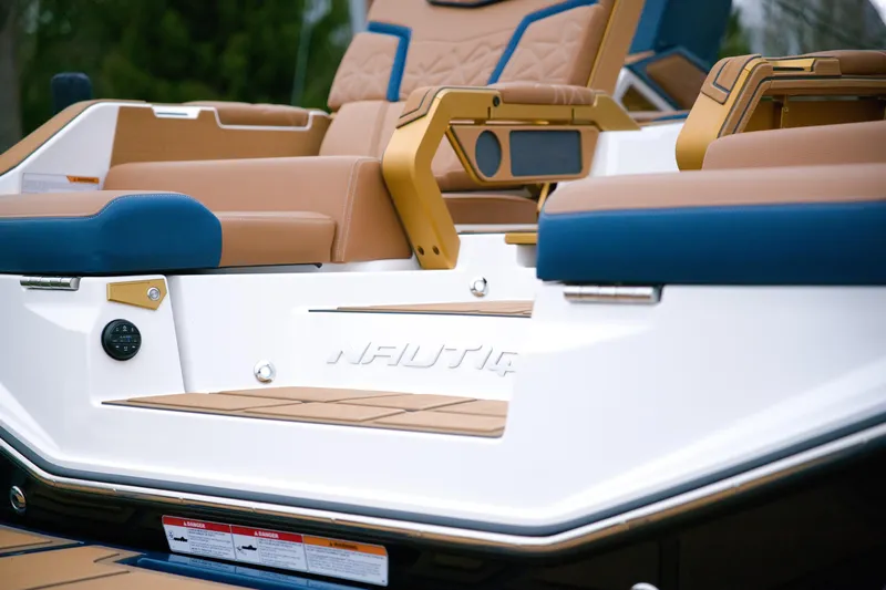  Yacht Photos Pics 2024 Nautique Super Air Nautique G23 Paragon interior with tan and blue seating.