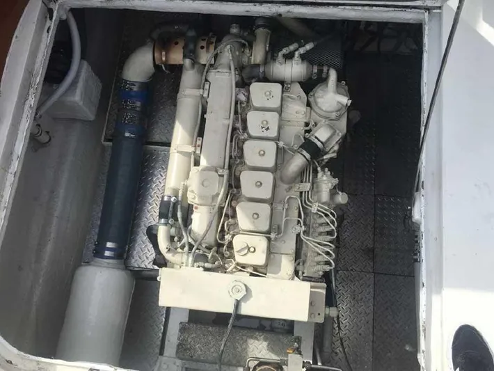 Blackjack Yacht Photos Pics Engine compartment of a 1984 Midnight Lace Rumrunner boat, showcasing detailed mechanical components.