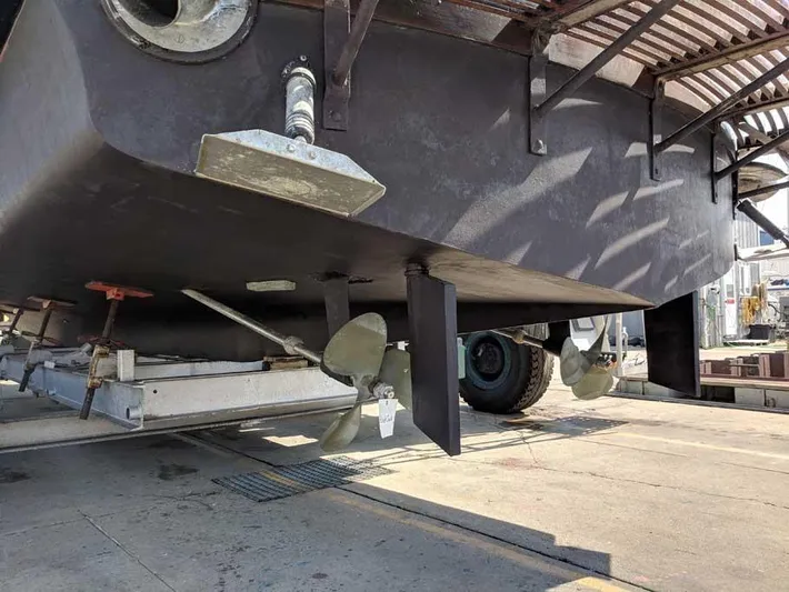 Blackjack Yacht Photos Pics 1984 Midnight Lace Rumrunner boat hull and propellers in dry dock.