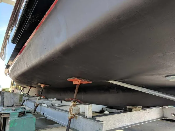 Blackjack Yacht Photos Pics 1984 Midnight Lace Rumrunner boat hull on a trailer, showcasing its sleek design.