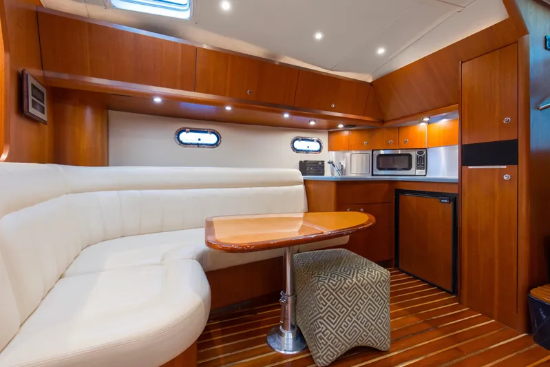 Forever Friday Yacht Photos Pics 2005 Tiara Yachts 3600 Sovran interior with kitchen, dining area, and wood finishes.