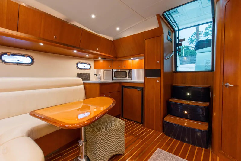Forever Friday Yacht Photos Pics Interior of 2005 Tiara Yachts 3600 Sovran with wood finish and modern amenities.