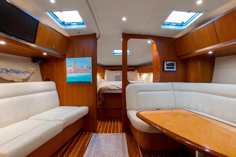 Forever Friday Yacht Photos Pics Luxurious interior of 2005 Tiara Yachts 3600 Sovran with elegant seating and wood finishes.