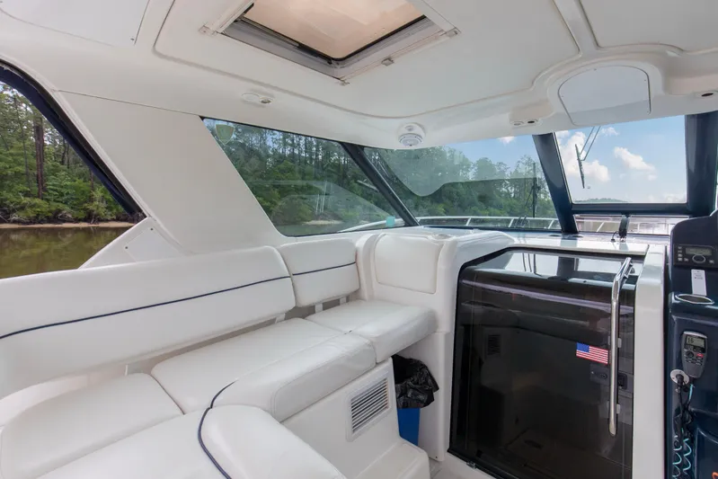 Forever Friday Yacht Photos Pics Interior of 2005 Tiara Yachts 3600 Sovran, featuring white seating and sleek design.