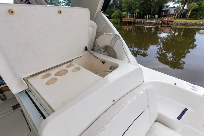 Forever Friday Yacht Photos Pics 2005 Tiara Yachts 3600 Sovran boat interior with sink and cup holders by a lake.
