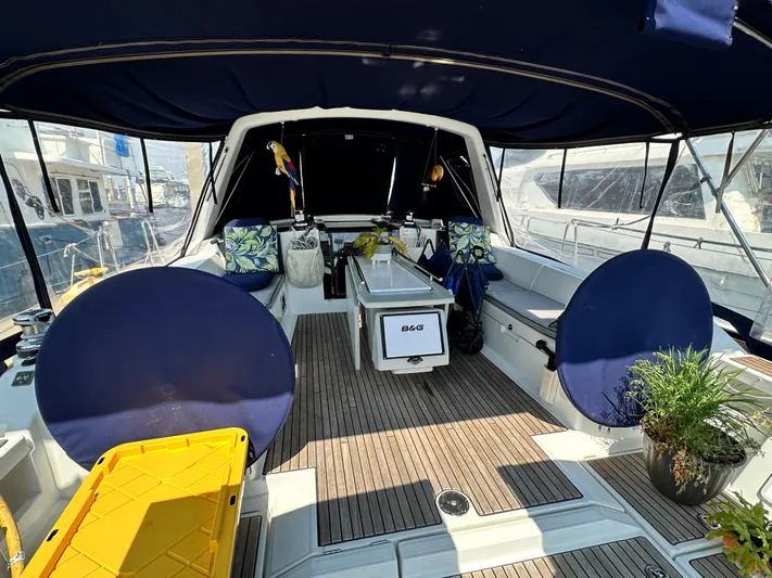 Lucky Yacht Photos Pics 2014 Beneteau Oceanis 45 yacht cockpit with seating, plants, and nautical decor.