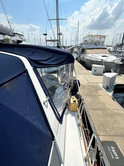Lucky Yacht Photos Pics 2014 Beneteau Oceanis 45 yacht docked at marina under clear sky.
