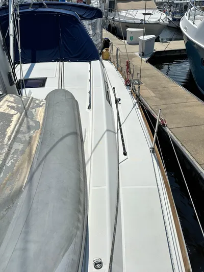 Lucky Yacht Photos Pics 2014 Beneteau Oceanis 45 sailboat deck view at marina.