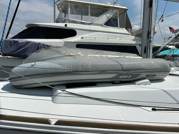 Lucky Yacht Photos Pics Inflatable dinghy on a 2014 Beneteau Oceanis 45 yacht deck at a marina.