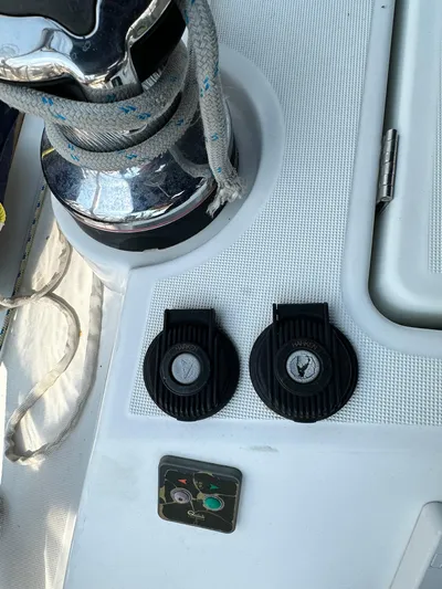 Lucky Yacht Photos Pics Close-up of a 2014 Beneteau Oceanis 45 yacht deck with winch and controls.