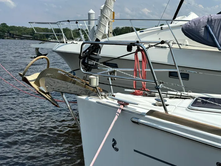 Lucky Yacht Photos Pics 2014 Beneteau Oceanis 45 sailboat docked, featuring anchor and deck details.