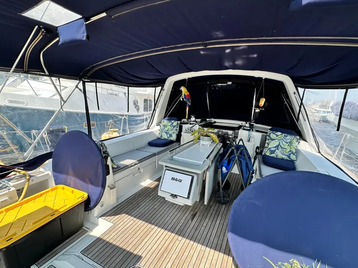 Lucky Yacht Photos Pics Interior view of 2014 Beneteau Oceanis 45 yacht with seating and canopy.
