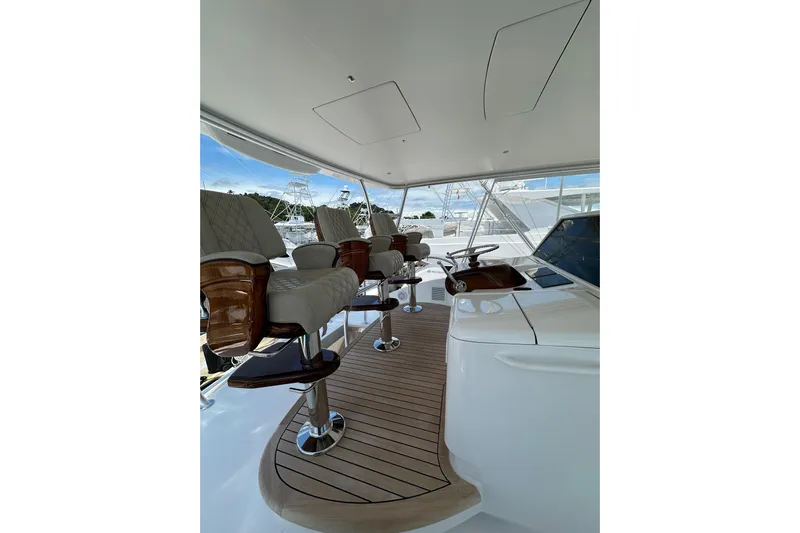 Boujie Yacht Photos Pics Luxurious interior of 2025 Viking 82 Convertible yacht with elegant seating and modern design.