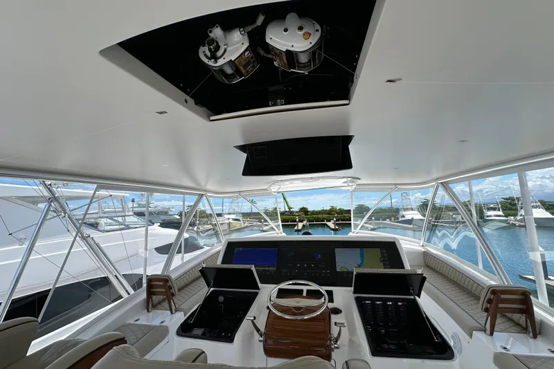 Boujie Yacht Photos Pics Interior view of 2025 Viking 82 Convertible yacht cockpit with advanced navigation systems.