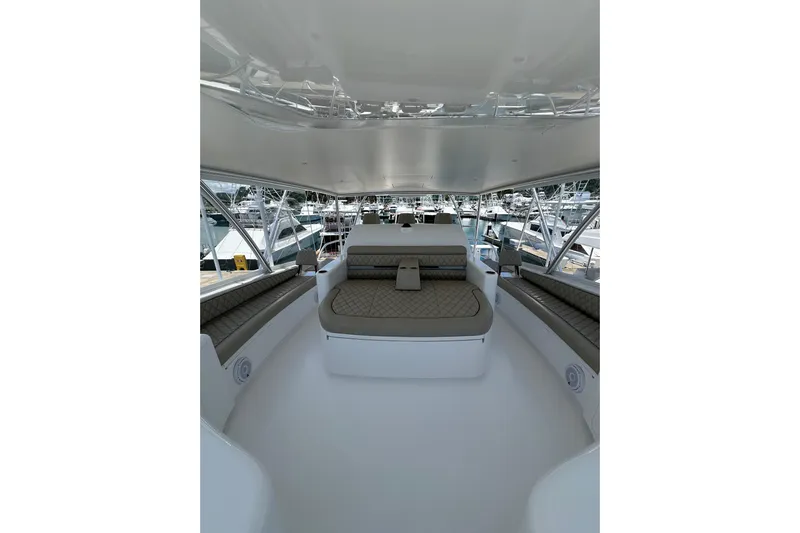 Boujie Yacht Photos Pics Luxurious interior of 2025 Viking 82 Convertible yacht with plush seating and modern design.