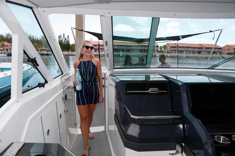  Yacht Photos Pics Manufacturer Provided Image: Woman aboard 2021 Formula 380 Super Sport Crossover OB yacht, enjoying a sunny day.