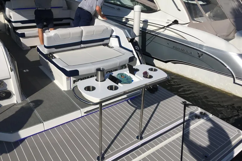  Yacht Photos Pics Manufacturer Provided Image: 2026 Formula 380 Super Sport Crossover OB boat with seating and table on deck.