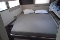 2017 Leopard 45 yacht interior bedroom with double bed and pillows