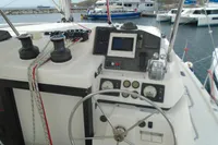 Leopard 45 catamaran helm station with navigation equipment and steering wheel, docked at marina, 2017 model.