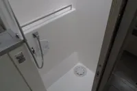 2017 Leopard 45 yacht shower area with handheld showerhead and drain.