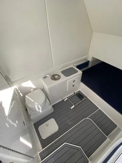 Bluefin Tales Yacht Photos Pics 2021 Front Runner 39 Center Console interior with toilet and sink.