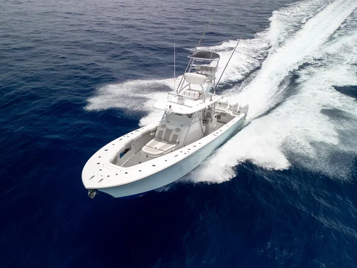 Bluefin Tales Yacht Photos Pics 2021 Front Runner 39 Center Console boat cruising on open ocean waters.