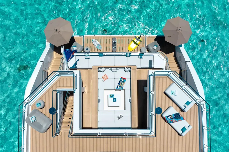 Reduce Yacht Photos Pics Luxurious Silver Yachts SilverCat 36M deck, 2024 model, with elegant seating and turquoise waters.