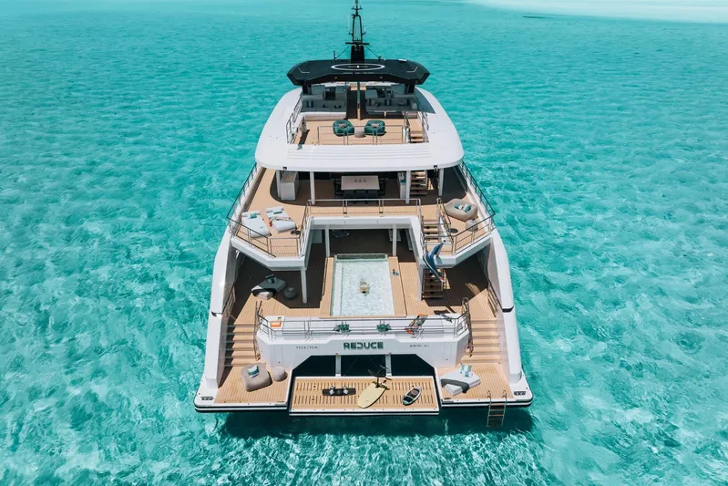 Reduce Yacht Photos Pics Luxurious 2024 Silver Yachts SilverCat 36M yacht on turquoise waters, featuring spacious decks.