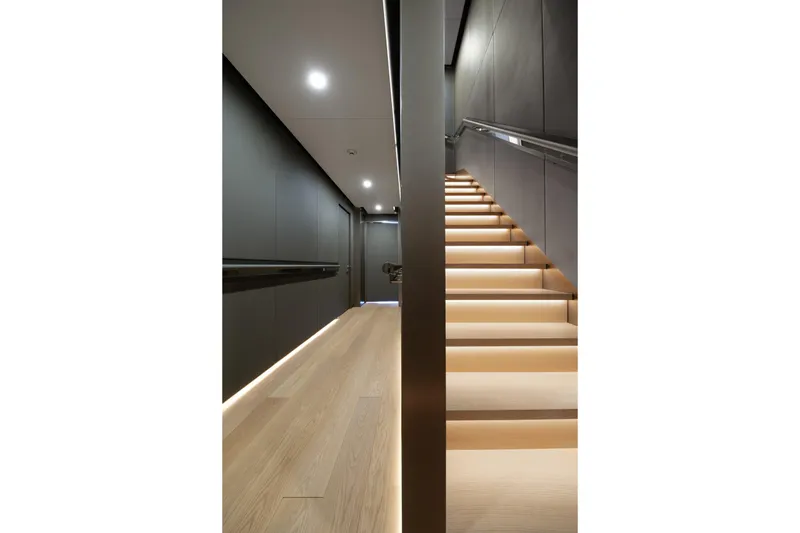 Reduce Yacht Photos Pics Modern interior of 2024 Silver Yachts SilverCat 36M with sleek staircase and ambient lighting.