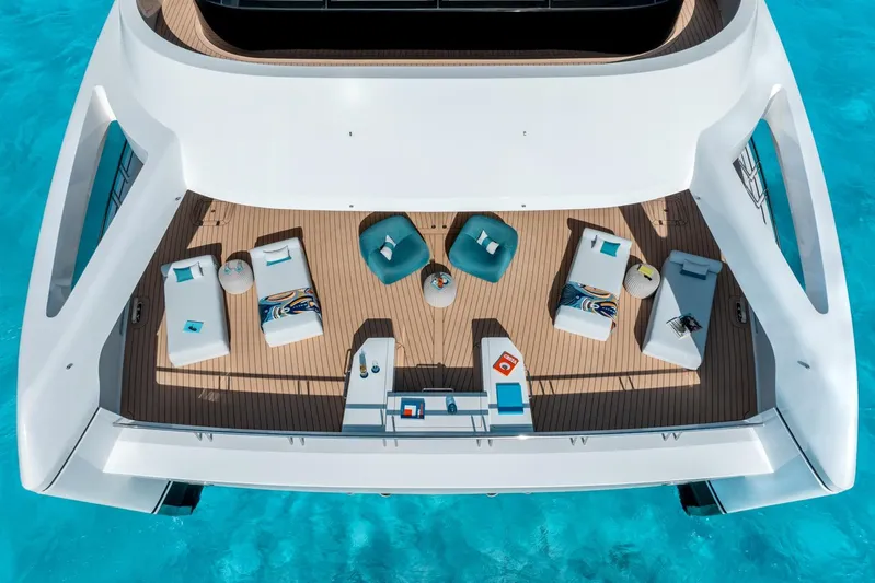 Reduce Yacht Photos Pics Luxurious deck of 2024 Silver Yachts SilverCat 36M, featuring elegant seating and turquoise waters.
