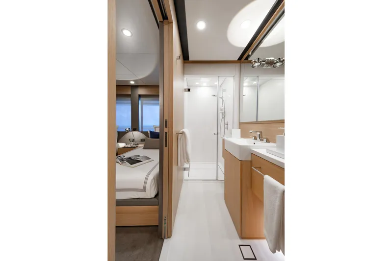 Reduce Yacht Photos Pics Luxurious bathroom and bedroom interior of 2024 Silver Yachts SilverCat 36M, featuring modern design.