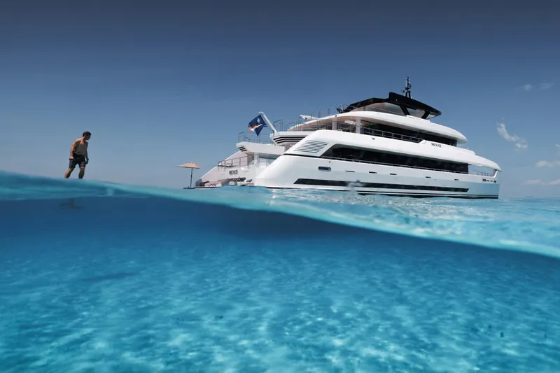 Reduce Yacht Photos Pics 2024 Silver Yachts SilverCat 36M luxury yacht on clear blue ocean water.