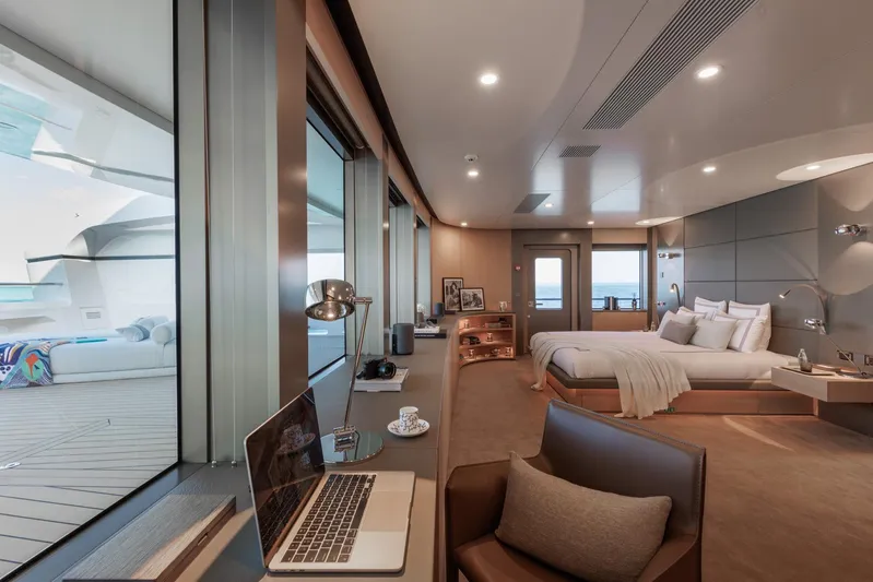 Reduce Yacht Photos Pics Luxurious interior of 2024 Silver Yachts SilverCat 36M, featuring elegant bedroom and workspace.
