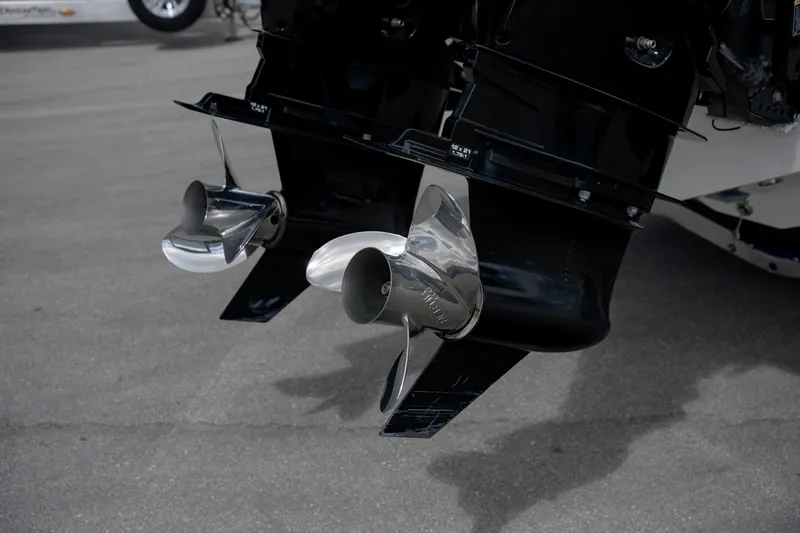  Yacht Photos Pics Twin propellers on a 2025 SeaVee 290B boat, parked on pavement.