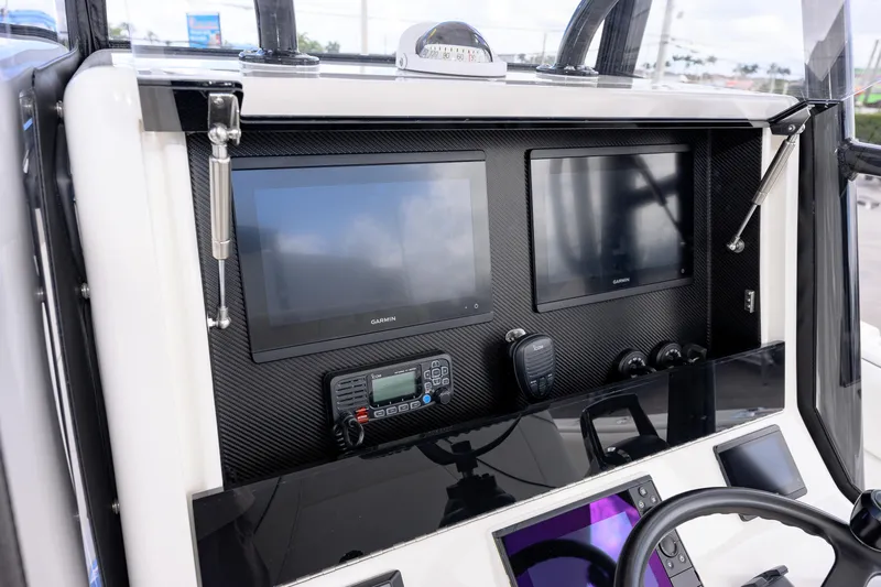  Yacht Photos Pics 2025 SeaVee 290B boat dashboard with dual Garmin displays and communication equipment.