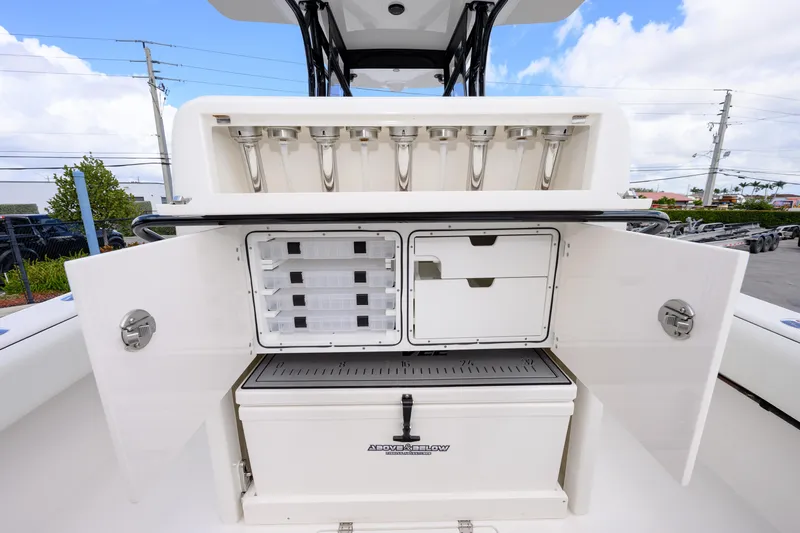  Yacht Photos Pics 2025 SeaVee 290B boat with open storage compartments and rod holders.