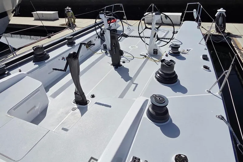 Peligroso Yacht Photos Pics Deck view of 2005 Dencho Marine Kernan 68 sailboat with winches and steering wheels.