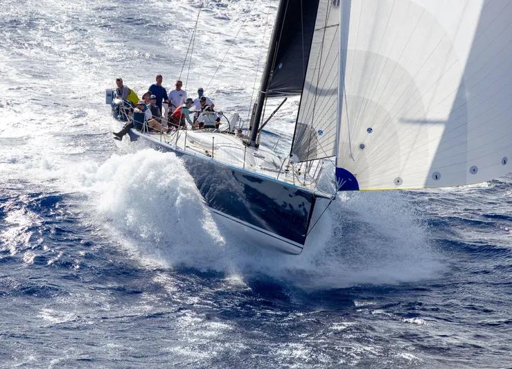 Peligroso Yacht Photos Pics Sailing yacht Dencho Marine Kernan 68, 2005 model, cutting through ocean waves.