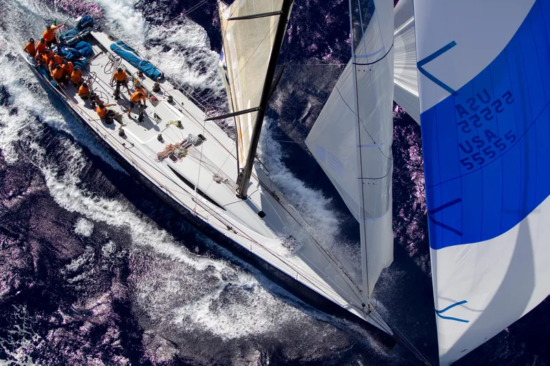 Peligroso Yacht Photos Pics Sailing yacht Dencho Marine Kernan 68, 2005, navigating ocean waves with crew on deck.