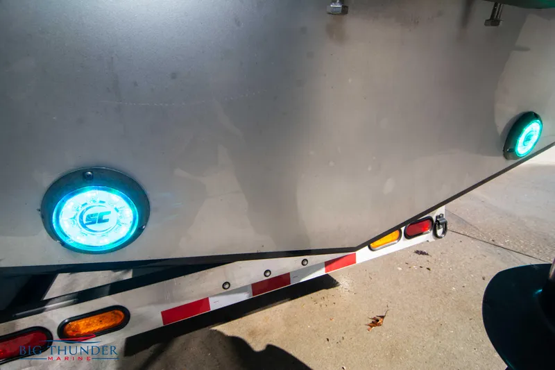  Yacht Photos Pics 2021 Fountain 38 SC boat on trailer with illuminated blue lights.