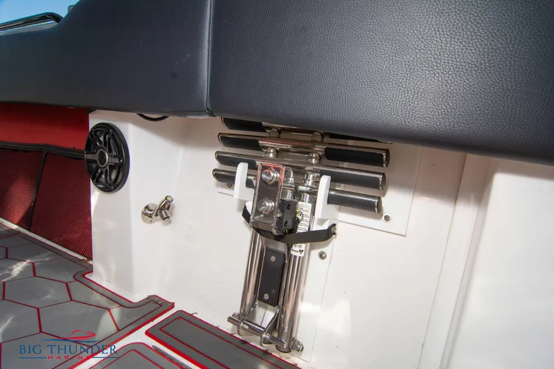  Yacht Photos Pics 2021 Fountain 38 SC boat interior with seating and control mechanisms.